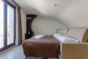 Postel nebo postele na pokoji v ubytování Hotel Don Giovanni