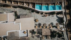 an aerial view of a resort with a swimming pool at Mythic Paros , Adults Only in Agia Irini Paros