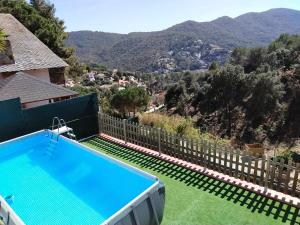 a swimming pool with a view of a mountain at Espacio Kybalion in Argentona