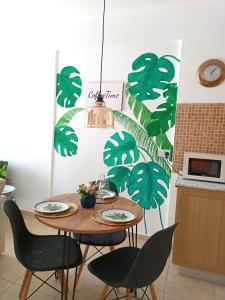 a kitchen with a table with chairs in a kitchen at Northern Cyprus Trikomo, Iskele, Long Beach, Caesar Resort 2 in İskele