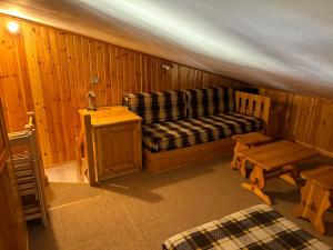a living room with a couch and a table at Casavacanza in Aprica