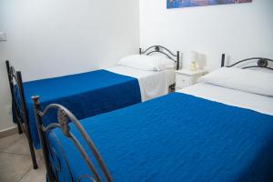 Siracusa Casa Tiche & Selene客房内的一张或多张床位