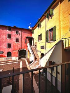 a view of a building with a staircase in front of it at Welcome Traveller AMORE APARTMENTS in Bardolino