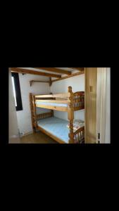 Krevet ili kreveti na kat u jedinici u objektu Maisonnette bord de plage