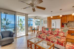 a living room with a couch and a table at The Hale Pau Hana in Kihei