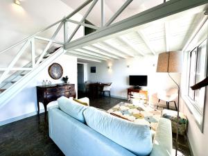 a living room with a couch and a table at Ocean dream apartment in Cascais