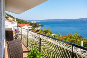 a balcony with a view of the ocean at Apartments Adisa in Omiš