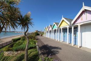 a row of houses next to the beach at Seaside House in Weymouth