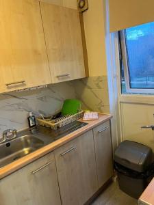 a kitchen counter with a sink and a window at 016- 1 bedroom church street F31 in London
