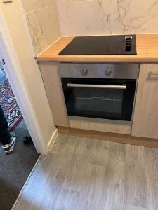 a stove in a kitchen with a counter top at 016- 1 bedroom church street F31 in London