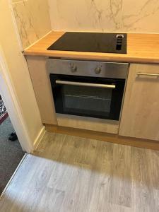 a kitchen with an oven in a counter top at 016- 1 bedroom church street F31 in London