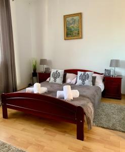 a bedroom with a bed with two towels on it at Pokoje Gościnne U Wioli in Zakopane