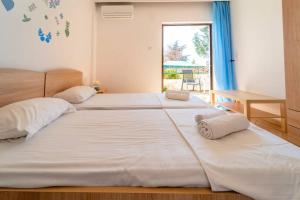 Postel nebo postele na pokoji v ubytování Veta Apartment - Beachside