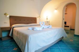 Кровать или кровати в номере Levante - lovely flat with terrace & sea view