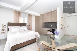 a bedroom with a bed and a glass table at VILLA LJUBAS in Srima +14 photos