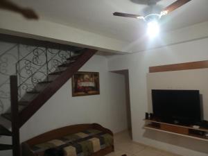 Et tv og/eller underholdning på Acomodação Pai eterno