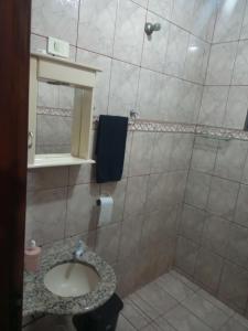 Et badeværelse på Acomodação Pai eterno