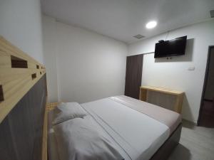 Postel nebo postele na pokoji v ubytování Hotel 42 Avenida