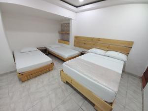Postel nebo postele na pokoji v ubytování Hotel 42 Avenida