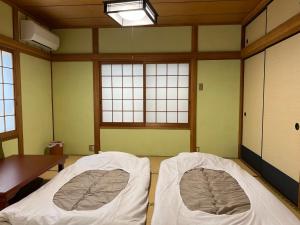 A bed or beds in a room at Shima Akari - Vacation STAY 66905v