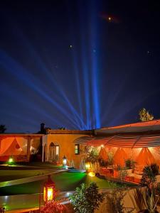 a night view of a house with a light trails at Riad Nouceiba Marrakech in Marrakech