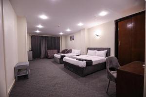 Postel nebo postele na pokoji v ubytování Royal Hotel Assiut