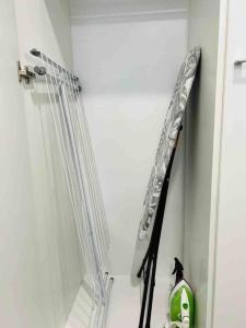 a room with some skis hanging on a wall at Apartment near the train station, free parking &Netflix in Kuopio