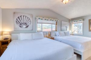 Postel nebo postele na pokoji v ubytování D & D Ocean Retreat - Meredith Lodging