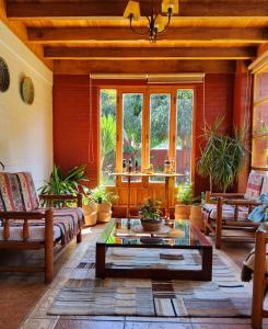 a living room with a couch and a table at Casa Emiluz in La Serena