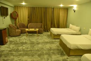 Postel nebo postele na pokoji v ubytování Royal Hotel Assiut