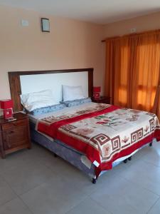 Ένα ή περισσότερα κρεβάτια σε δωμάτιο στο Departamento Relax La Tuquita