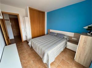 Postel nebo postele na pokoji v ubytování Apartamento Portosin con piscina al lado de la playa