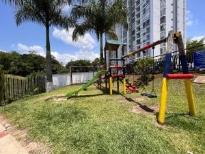 a park with a playground with a slide at Super apartamento en club residencial in Pereira