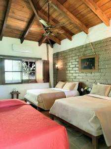Postel nebo postele na pokoji v ubytování Hotel Hacienda San Lucas