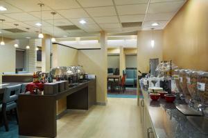a restaurant with a food counter and a cafeteria at Residence Inn by Marriott San Antonio Downtown Market Square in San Antonio