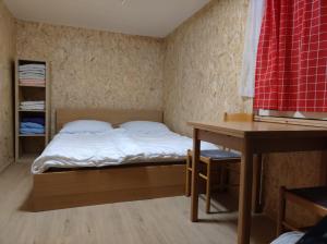 Letto o letti in una camera di Lesní chaty "Hogo Fogo"