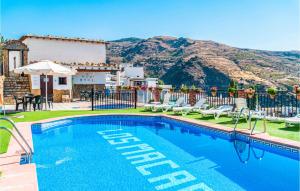a swimming pool with a view of a mountain at Amazing Home In Mecina Bombarn With Wifi in Mecina Bombarón