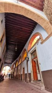 a building with arches and awning on a street at Hotel Mansion Von Humboldt in Guanajuato