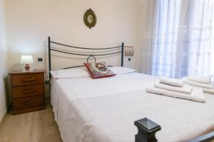 Posteľ alebo postele v izbe v ubytovaní Corallo holiday house Acitrezza