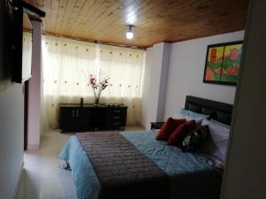 Habitaciones en Edificio Ginebra Manizales客房内的一张或多张床位