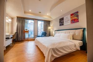 Voodi või voodid majutusasutuse Wenpin Hotel - Pier 2 toas
