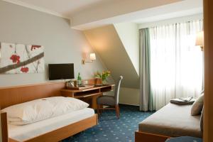 Postel nebo postele na pokoji v ubytování Landhotel Zur Bretzel
