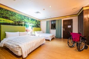 Voodi või voodid majutusasutuse Wenpin Hotel - Pier 2 toas