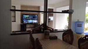a dining room with a table and a mirror at Angeles Private Pool Villa in Angeles