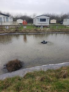 a buoy in the middle of a body of water at CCT Caravan in Turnberry