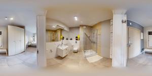 a bathroom with a shower and a toilet and a sink at SGIGOLF Apartments No3 No2 in Wejherowo