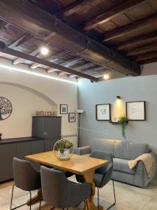 a living room with a table and a couch at La corte di Frascati in Frascati