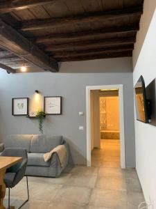 a living room with a couch and a table at La corte di Frascati in Frascati