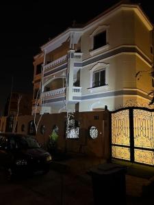 a building with a clock on the side of it at Villa 267 Residence in Cairo
