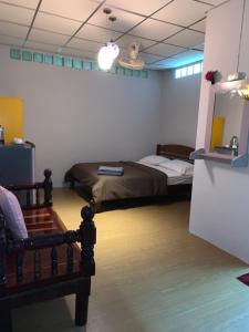 Postel nebo postele na pokoji v ubytování Holiday Phangan - Hostel & Bar